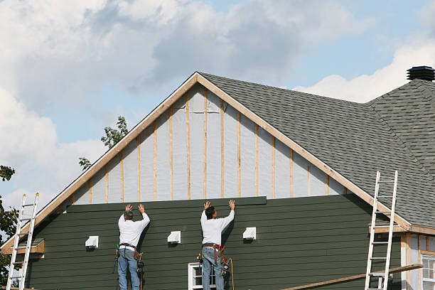 Professional Storm Damage Siding Repair technician working in Pierson, FL